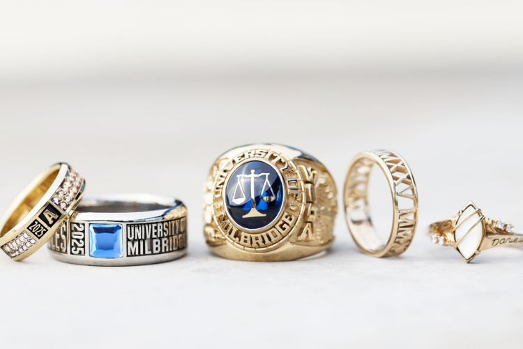 Line up of various Jostens class rings